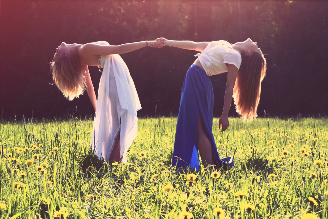 two girls shaking hands